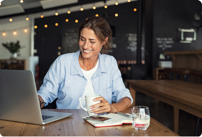 woman working on laptop at coffee shop
